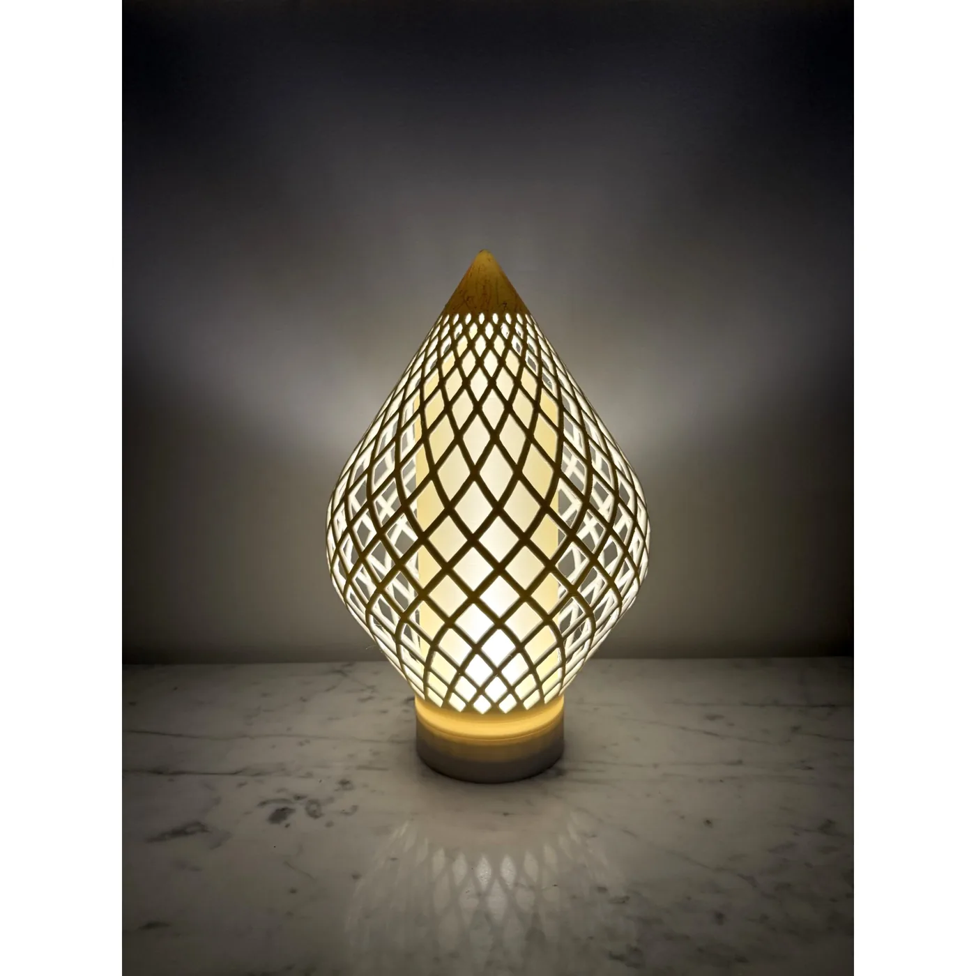 Reef Diagrid lit, close front view showing the warm diffused core