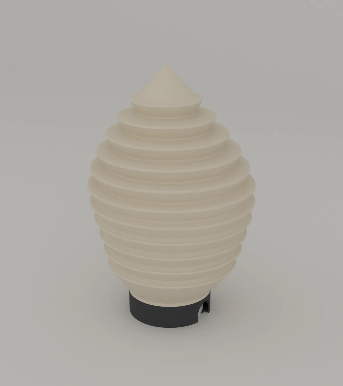 Strata table lamp, three-quarter view, on its charcoal base ring